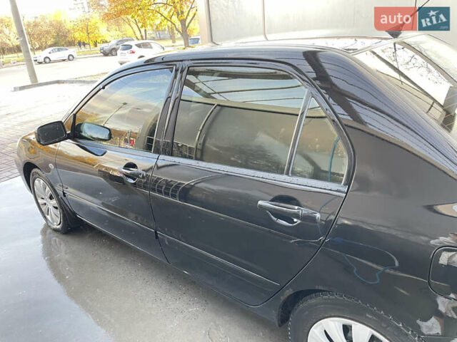 Черный Мицубиси Лансер, объемом двигателя 1.59 л и пробегом 348 тыс. км за 4200 $, фото 2 на Automoto.ua