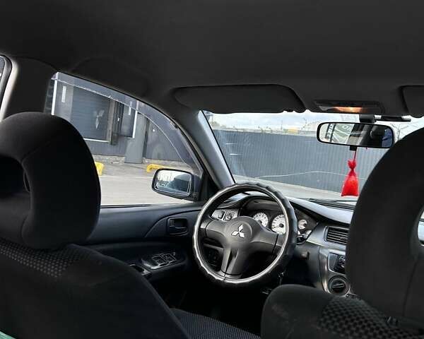 Чорний Міцубісі Lancer, об'ємом двигуна 1.6 л та пробігом 310 тис. км за 3500 $, фото 18 на Automoto.ua