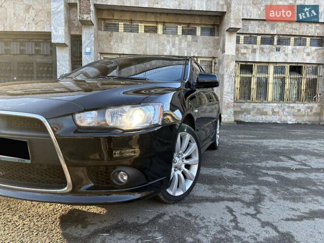 Черный Мицубиси Лансер, объемом двигателя 2 л и пробегом 236 тыс. км за 6450 $, фото 2 на Automoto.ua