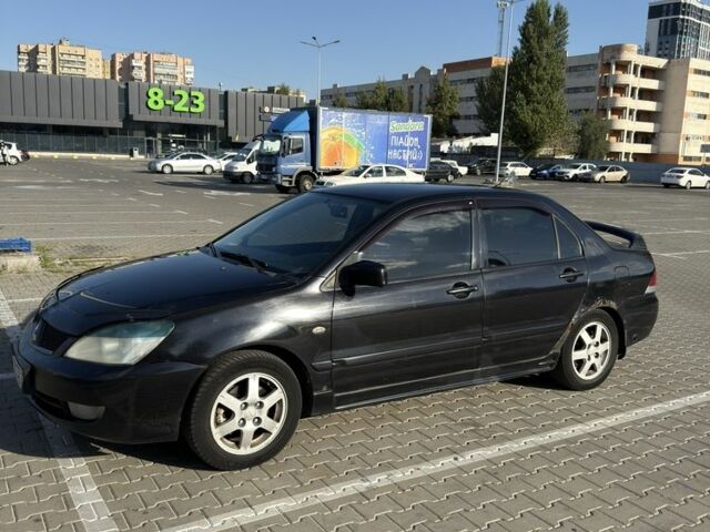 Чорний Міцубісі Lancer, об'ємом двигуна 1.6 л та пробігом 364 тис. км за 3000 $, фото 5 на Automoto.ua