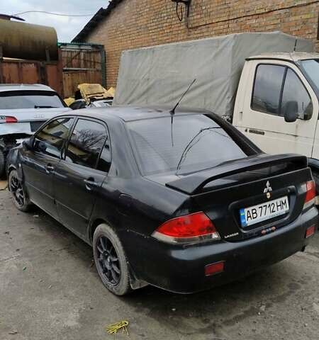 Черный Мицубиси Лансер, объемом двигателя 1.6 л и пробегом 200 тыс. км за 2000 $, фото 4 на Automoto.ua