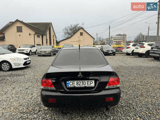 Черный Мицубиси Лансер, объемом двигателя 1.58 л и пробегом 202 тыс. км за 4100 $, фото 16 на Automoto.ua