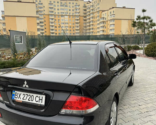 Черный Мицубиси Лансер, объемом двигателя 1.6 л и пробегом 240 тыс. км за 5200 $, фото 12 на Automoto.ua