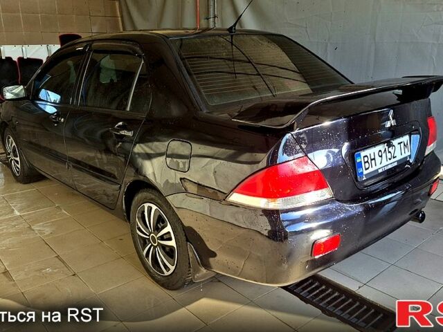 Черный Мицубиси Лансер, объемом двигателя 1.6 л и пробегом 205 тыс. км за 5500 $, фото 3 на Automoto.ua