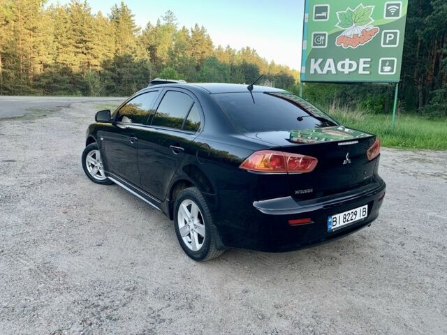 Чорний Міцубісі Lancer, об'ємом двигуна 2 л та пробігом 195 тис. км за 7000 $, фото 3 на Automoto.ua