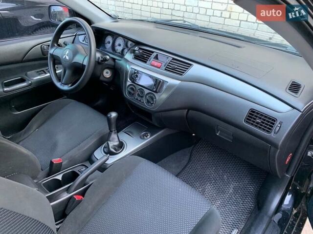 Черный Мицубиси Лансер, объемом двигателя 1.58 л и пробегом 250 тыс. км за 4900 $, фото 3 на Automoto.ua