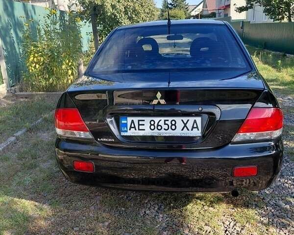 Чорний Міцубісі Lancer, об'ємом двигуна 1.6 л та пробігом 221 тис. км за 5200 $, фото 5 на Automoto.ua