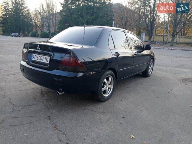 Чорний Міцубісі Lancer, об'ємом двигуна 1.58 л та пробігом 286 тис. км за 4950 $, фото 8 на Automoto.ua
