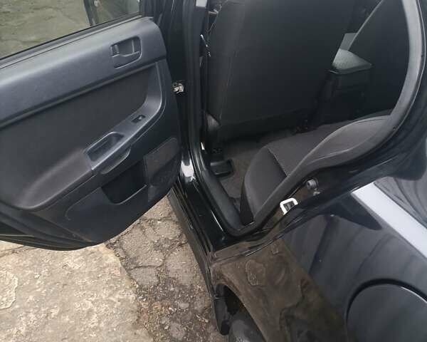 Черный Мицубиси Лансер, объемом двигателя 2 л и пробегом 192 тыс. км за 6350 $, фото 12 на Automoto.ua