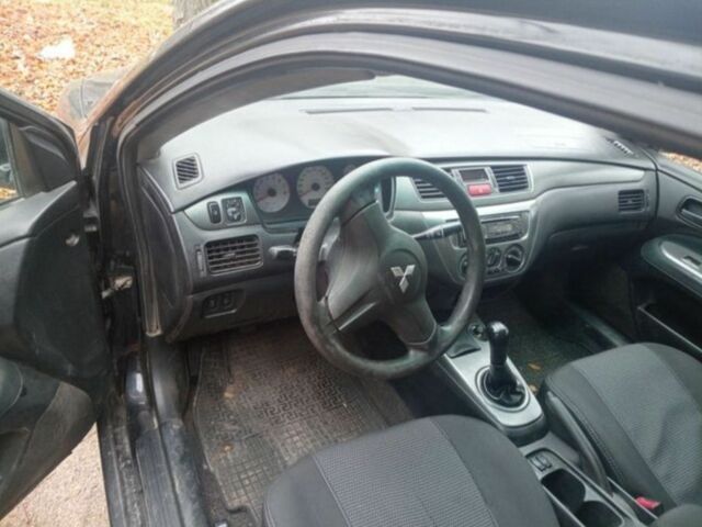 Черный Мицубиси Лансер, объемом двигателя 6 л и пробегом 190 тыс. км за 4500 $, фото 5 на Automoto.ua