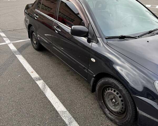 Чорний Міцубісі Lancer, об'ємом двигуна 1.6 л та пробігом 245 тис. км за 4500 $, фото 2 на Automoto.ua
