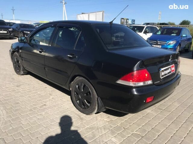 Чорний Міцубісі Lancer, об'ємом двигуна 1.6 л та пробігом 356 тис. км за 4590 $, фото 12 на Automoto.ua