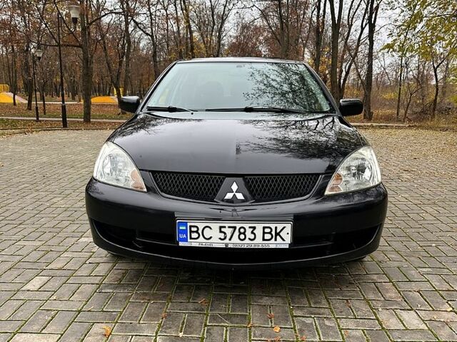 Черный Мицубиси Лансер, объемом двигателя 1.6 л и пробегом 185 тыс. км за 5500 $, фото 2 на Automoto.ua