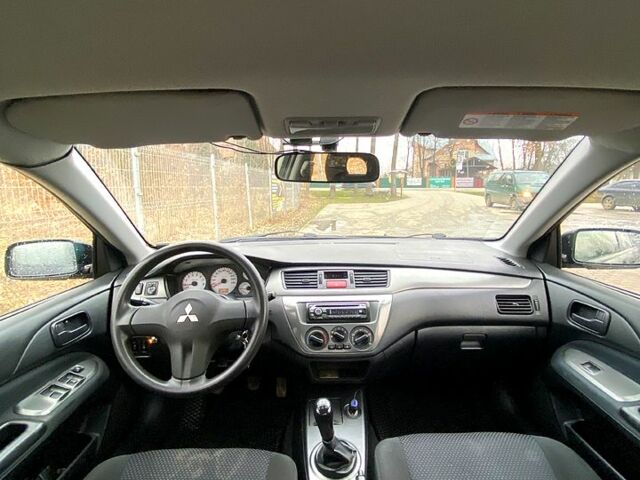 Черный Мицубиси Лансер, объемом двигателя 1.6 л и пробегом 240 тыс. км за 4200 $, фото 2 на Automoto.ua