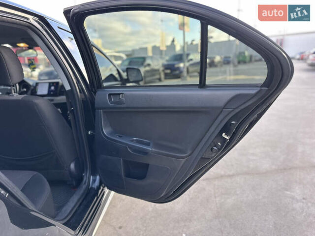 Чорний Міцубісі Lancer, об'ємом двигуна 2 л та пробігом 290 тис. км за 5900 $, фото 25 на Automoto.ua