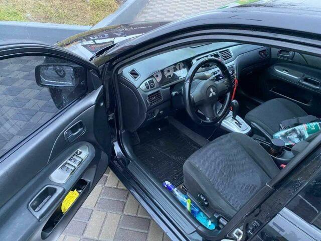 Чорний Міцубісі Lancer, об'ємом двигуна 1.6 л та пробігом 229 тис. км за 4200 $, фото 7 на Automoto.ua