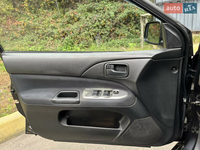 Чорний Міцубісі Lancer, об'ємом двигуна 1.58 л та пробігом 192 тис. км за 4500 $, фото 13 на Automoto.ua
