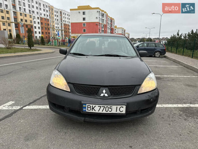 Чорний Міцубісі Lancer, об'ємом двигуна 1.58 л та пробігом 388 тис. км за 2300 $, фото 2 на Automoto.ua