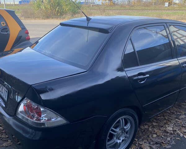 Мицубиси Лансер 2008 в Киеве на Automoto.ua Черный Мицубиси Лансер, объемом двигателя 1.6 л и пробегом 72 тыс. км за 2650 $, фото 6 на Automoto.ua