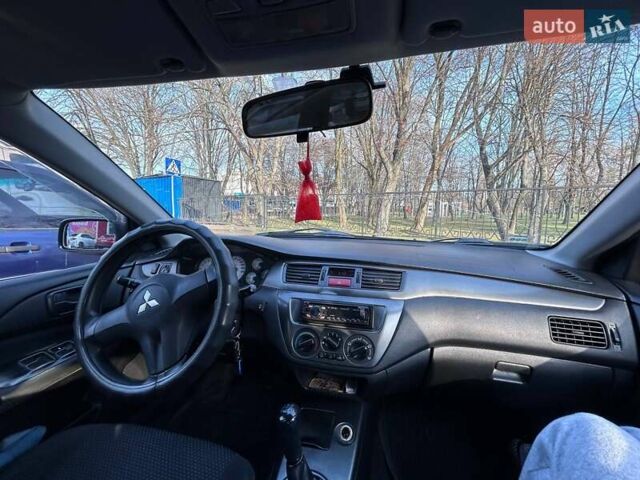 Чорний Міцубісі Lancer, об'ємом двигуна 1.6 л та пробігом 310 тис. км за 3500 $, фото 45 на Automoto.ua