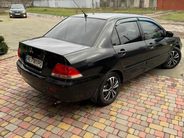 Чорний Міцубісі Lancer, об'ємом двигуна 1.6 л та пробігом 220 тис. км за 3600 $, фото 3 на Automoto.ua