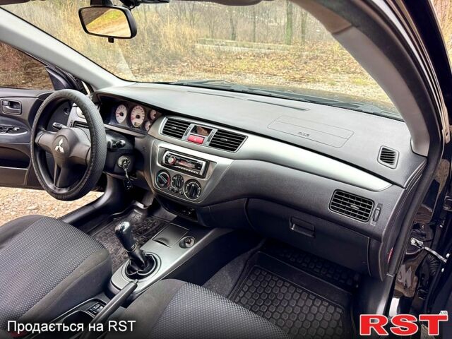 Черный Мицубиси Лансер, объемом двигателя 1.6 л и пробегом 216 тыс. км за 5190 $, фото 12 на Automoto.ua