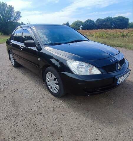 Черный Мицубиси Лансер, объемом двигателя 1.6 л и пробегом 243 тыс. км за 4500 $, фото 3 на Automoto.ua