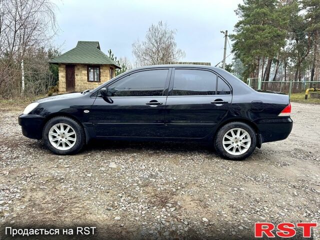 Черный Мицубиси Лансер, объемом двигателя 1.6 л и пробегом 216 тыс. км за 5190 $, фото 1 на Automoto.ua