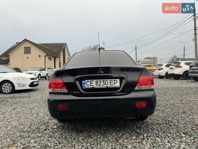 Черный Мицубиси Лансер, объемом двигателя 1.58 л и пробегом 202 тыс. км за 4100 $, фото 17 на Automoto.ua