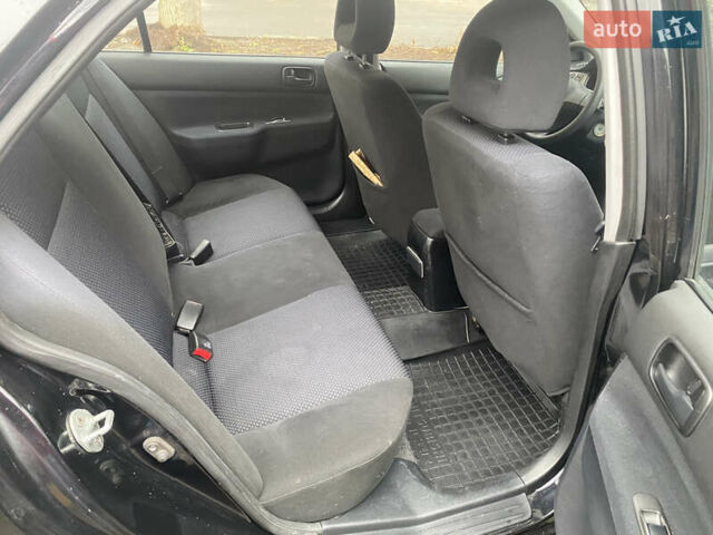 Черный Мицубиси Лансер, объемом двигателя 1.6 л и пробегом 143 тыс. км за 3000 $, фото 7 на Automoto.ua