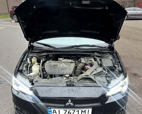 Черный Мицубиси Лансер, объемом двигателя 2 л и пробегом 217 тыс. км за 7000 $, фото 10 на Automoto.ua