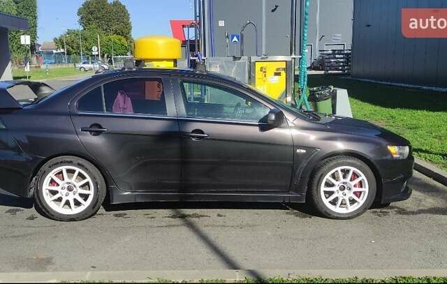 Чорний Міцубісі Lancer, об'ємом двигуна 2 л та пробігом 134 тис. км за 29034 $, фото 1 на Automoto.ua