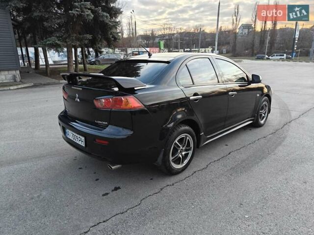 Черный Мицубиси Лансер, объемом двигателя 2 л и пробегом 245 тыс. км за 5600 $, фото 4 на Automoto.ua