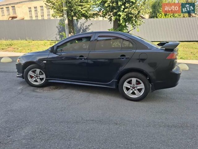 Черный Мицубиси Лансер, объемом двигателя 2 л и пробегом 230 тыс. км за 7000 $, фото 18 на Automoto.ua