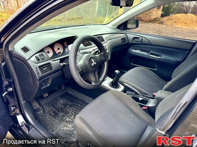 Черный Мицубиси Лансер, объемом двигателя 1.6 л и пробегом 216 тыс. км за 5190 $, фото 8 на Automoto.ua