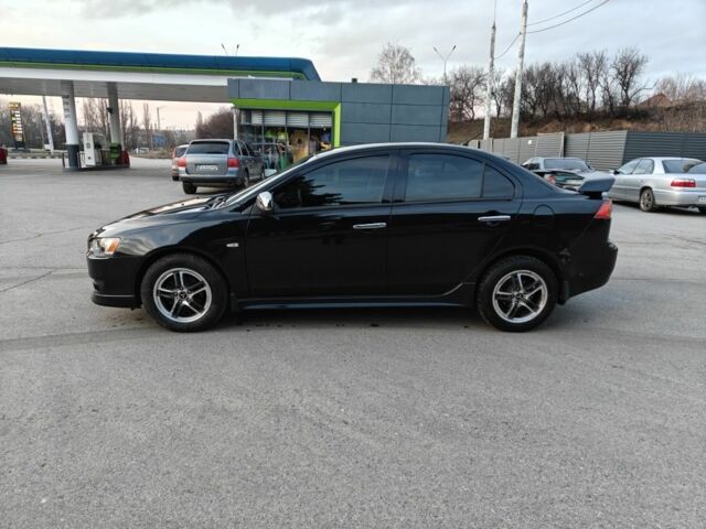 Черный Мицубиси Лансер, объемом двигателя 2 л и пробегом 245 тыс. км за 5600 $, фото 1 на Automoto.ua