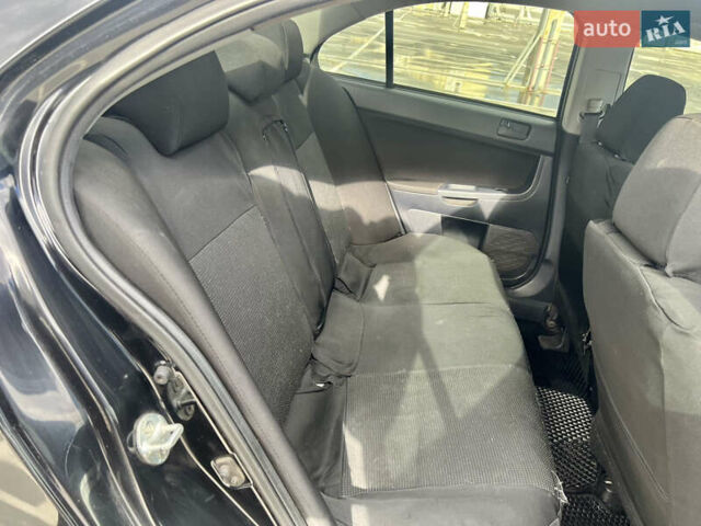 Мицубиси Лансер 2008 в Киеве на Automoto.ua Черный Мицубиси Лансер, объемом двигателя 2 л и пробегом 219 тыс. км за 6500 $, фото 8 на Automoto.ua