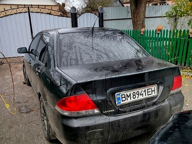 Чорний Міцубісі Lancer, об'ємом двигуна 1.6 л та пробігом 126 тис. км за 4500 $, фото 1 на Automoto.ua