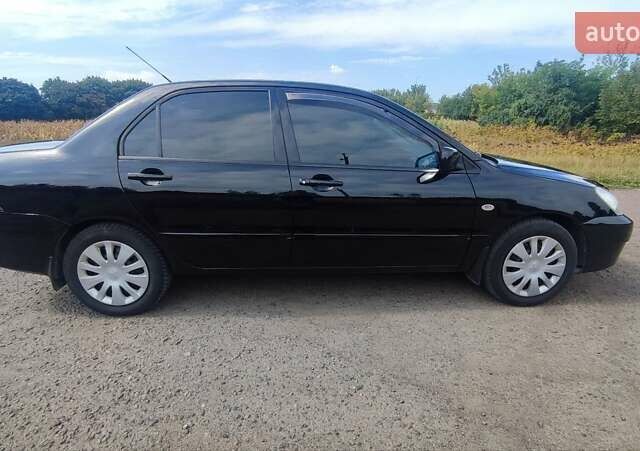 Черный Мицубиси Лансер, объемом двигателя 1.6 л и пробегом 243 тыс. км за 4500 $, фото 6 на Automoto.ua