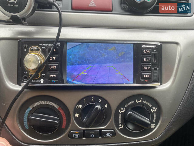 Черный Мицубиси Лансер, объемом двигателя 1.58 л и пробегом 211 тыс. км за 6333 $, фото 32 на Automoto.ua