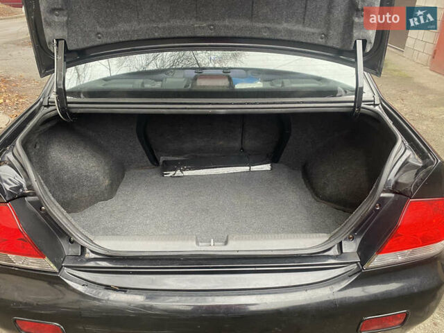 Черный Мицубиси Лансер, объемом двигателя 1.6 л и пробегом 143 тыс. км за 3000 $, фото 12 на Automoto.ua