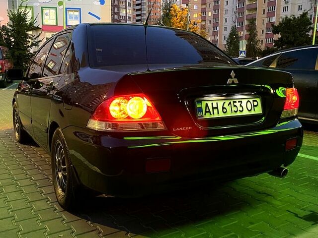 Чорний Міцубісі Lancer, об'ємом двигуна 1.6 л та пробігом 280 тис. км за 4700 $, фото 4 на Automoto.ua