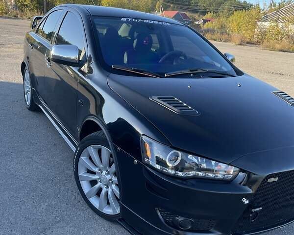 Чорний Міцубісі Lancer, об'ємом двигуна 2 л та пробігом 223 тис. км за 7800 $, фото 3 на Automoto.ua