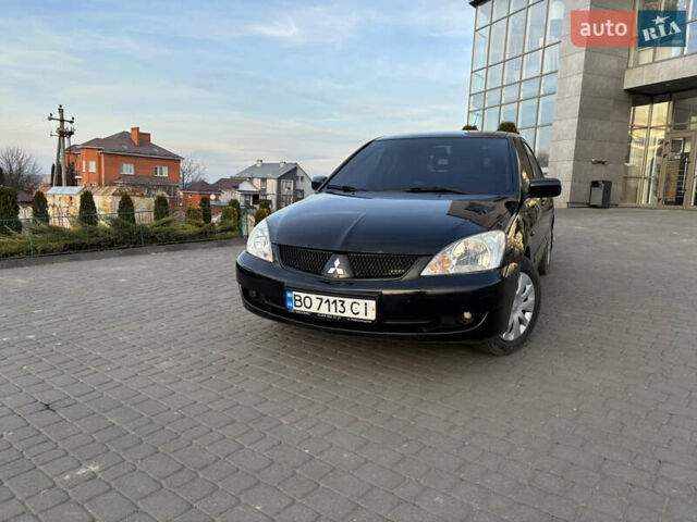 Чорний Міцубісі Lancer, об'ємом двигуна 1.58 л та пробігом 344 тис. км за 3999 $, фото 7 на Automoto.ua