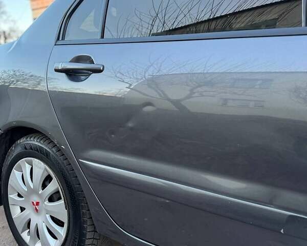 Черный Мицубиси Лансер, объемом двигателя 1.6 л и пробегом 225 тыс. км за 3400 $, фото 10 на Automoto.ua