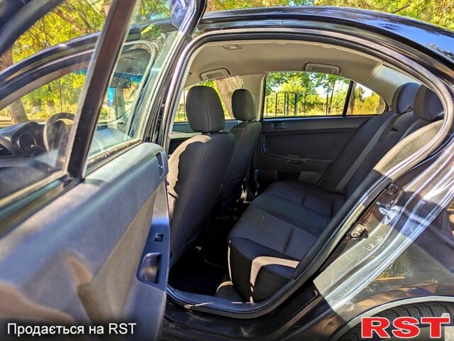 Черный Мицубиси Лансер, объемом двигателя 1.5 л и пробегом 235 тыс. км за 5250 $, фото 6 на Automoto.ua