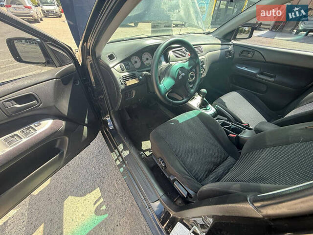 Чорний Міцубісі Lancer, об'ємом двигуна 1.6 л та пробігом 292 тис. км за 3600 $, фото 20 на Automoto.ua