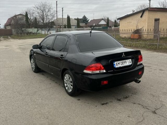 Черный Мицубиси Лансер, объемом двигателя 1.6 л и пробегом 1 тыс. км за 3750 $, фото 3 на Automoto.ua