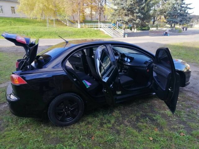 Міцубісі Lancer 2008 у Києві на Automoto.ua Чорний Міцубісі Lancer, об'ємом двигуна 2 л та пробігом 196 тис. км за 5500 $, фото 20 на Automoto.ua