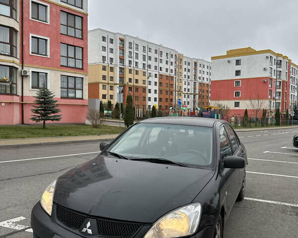 Чорний Міцубісі Lancer, об'ємом двигуна 1.58 л та пробігом 388 тис. км за 2300 $, фото 1 на Automoto.ua